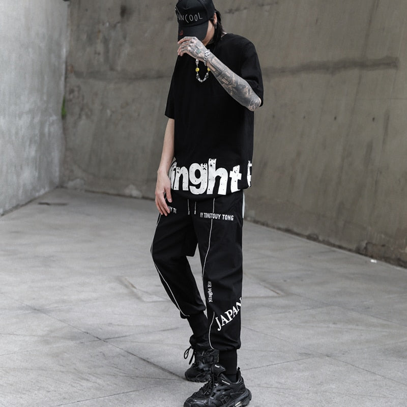 Pantalones jogger de hombre con estampado de bordes blancos sueltos