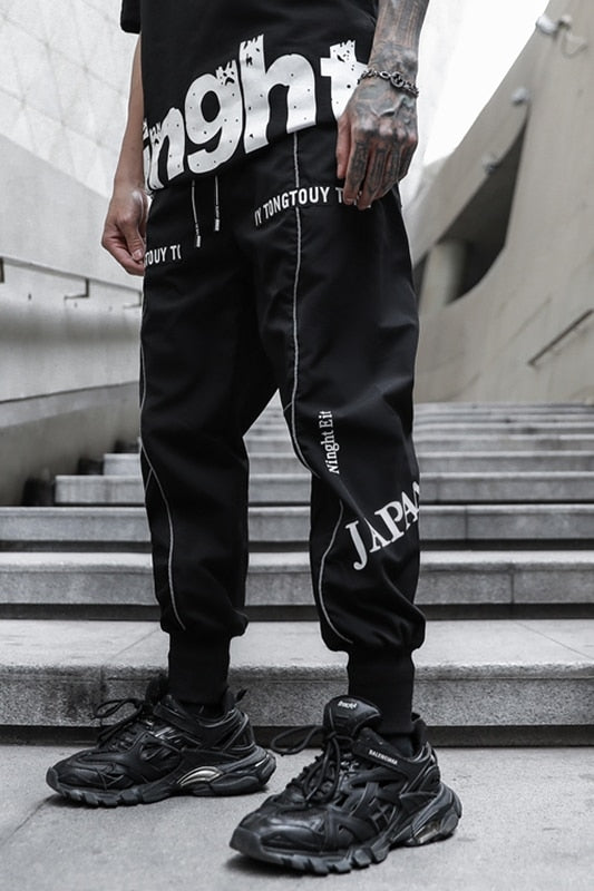 Pantalones jogger de hombre con estampado de bordes blancos sueltos