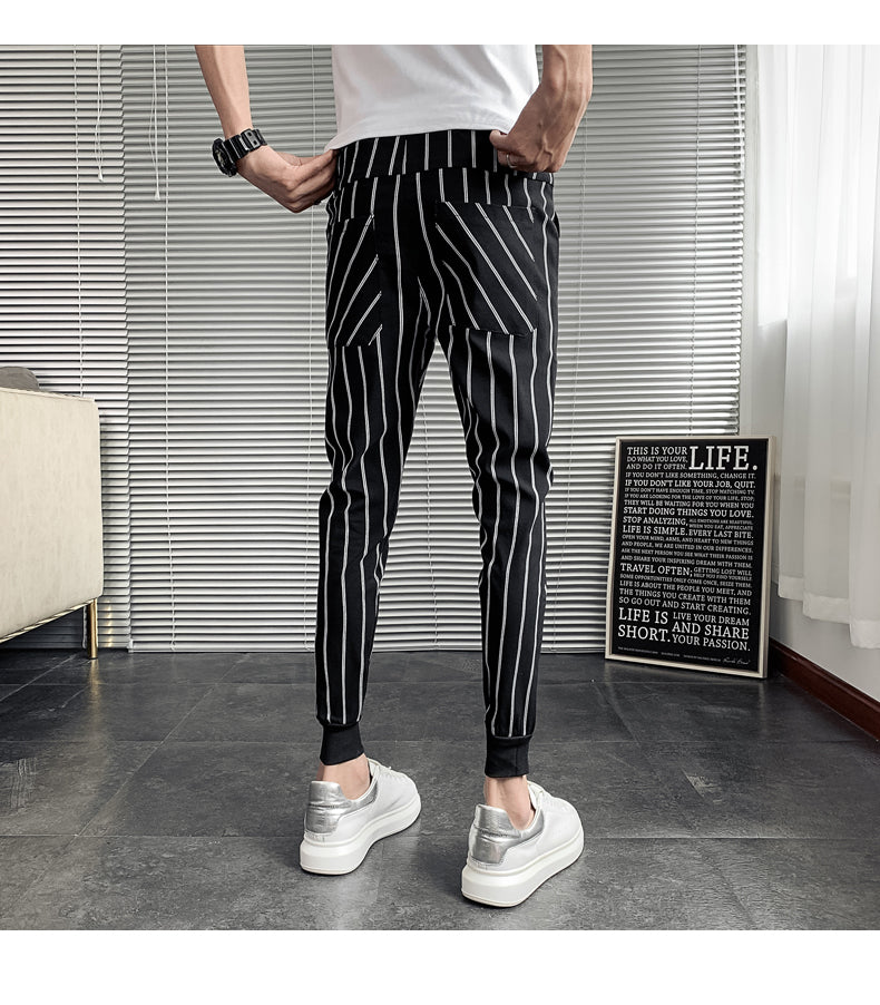 Pantalones de pierna cónicos monocromáticos de rayas verticales para hombres