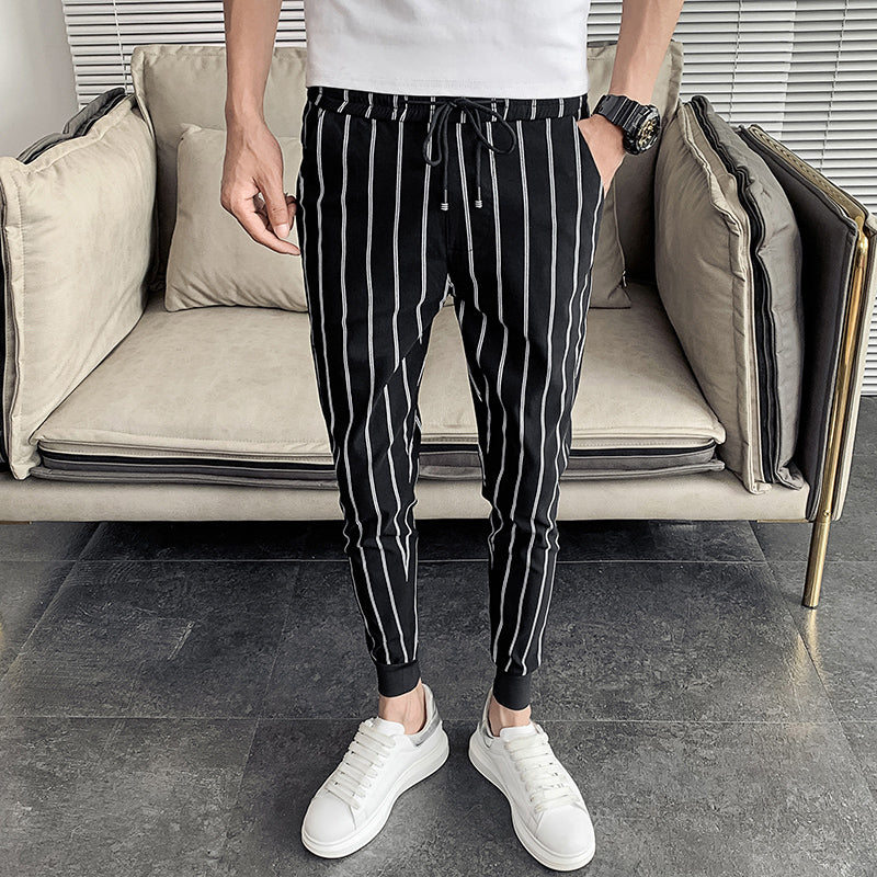 Pantalones de pierna cónicos monocromáticos de rayas verticales para hombres