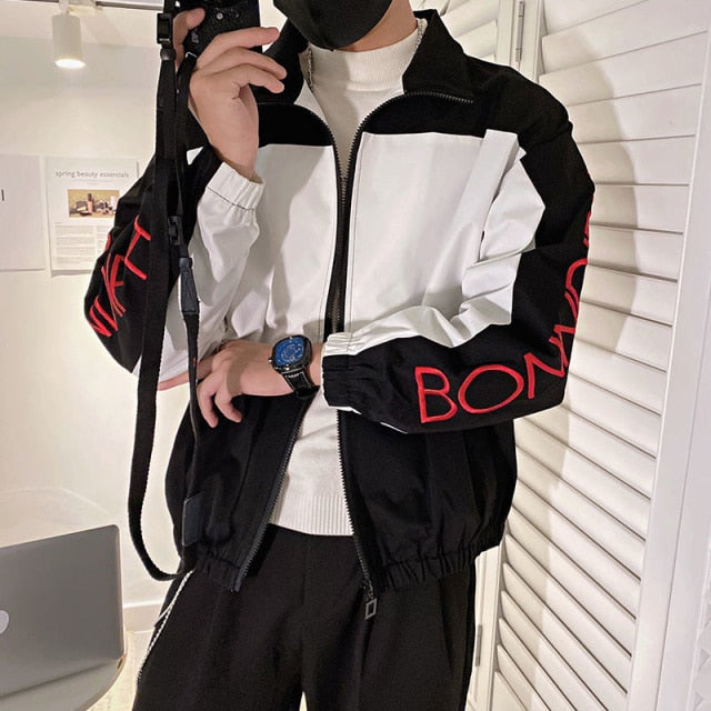 Chaqueta de poliéster de manga larga negra y blanca